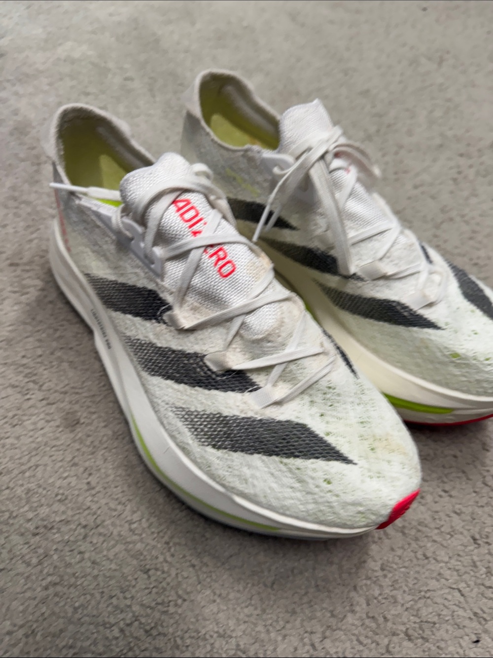 adidas White Running Shoes with Black Stripes and Neon Accents